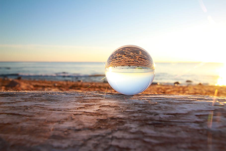 Clear Marble Toy Reflecting Seashore during Golden Hour, beach HD wallpaper