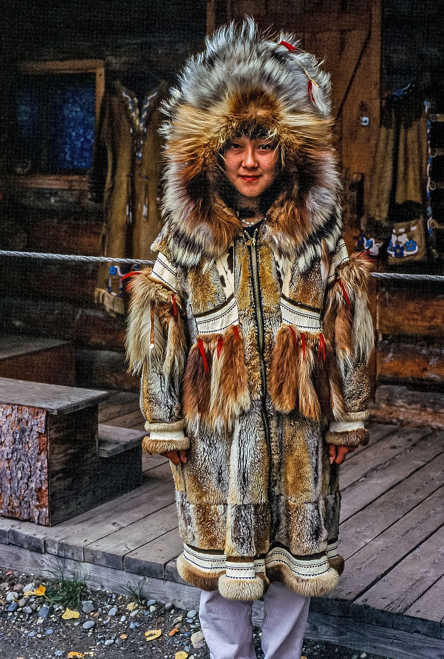 Young american woman in the traditional fur clothing of her native tribe