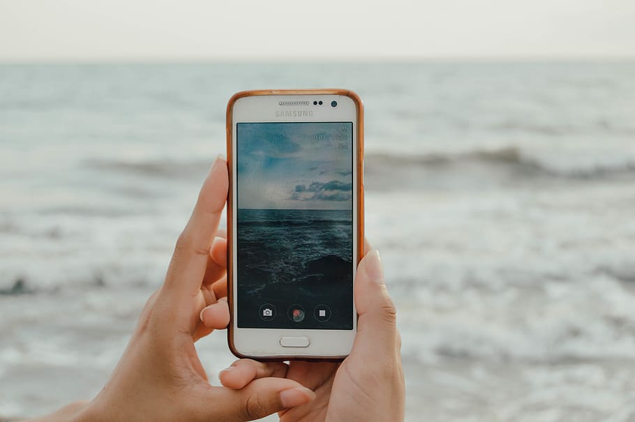 Person Holding Smartphone Capturing Ocean Waves, cell phone, electronics HD wallpaper