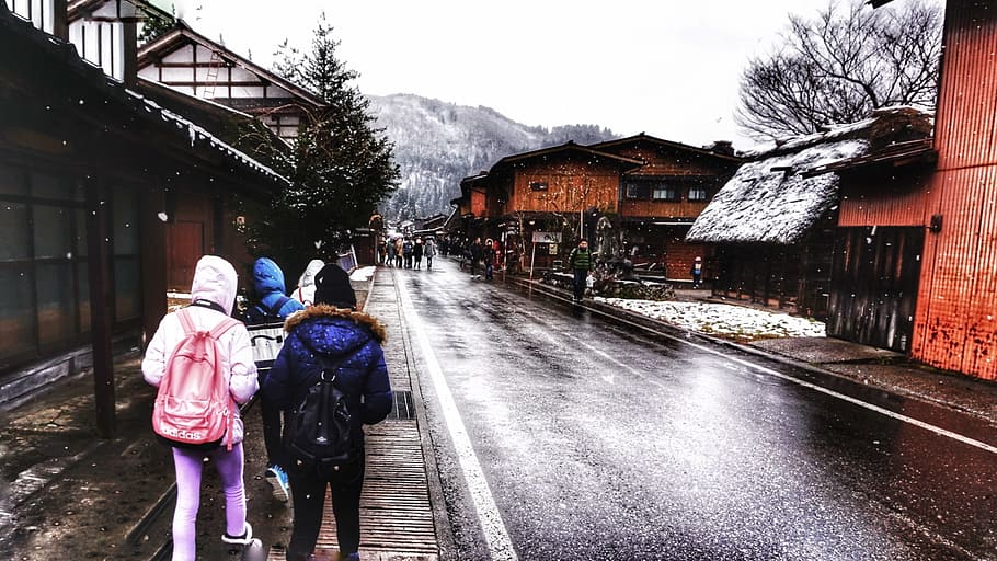 Three People in Hoodie Jackets Walking Beside Road, buildings HD wallpaper