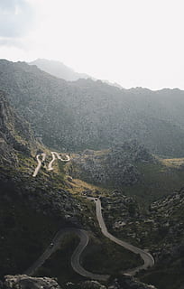 aerial photo of mountains covered by trees, road, bend, pass HD wallpaper