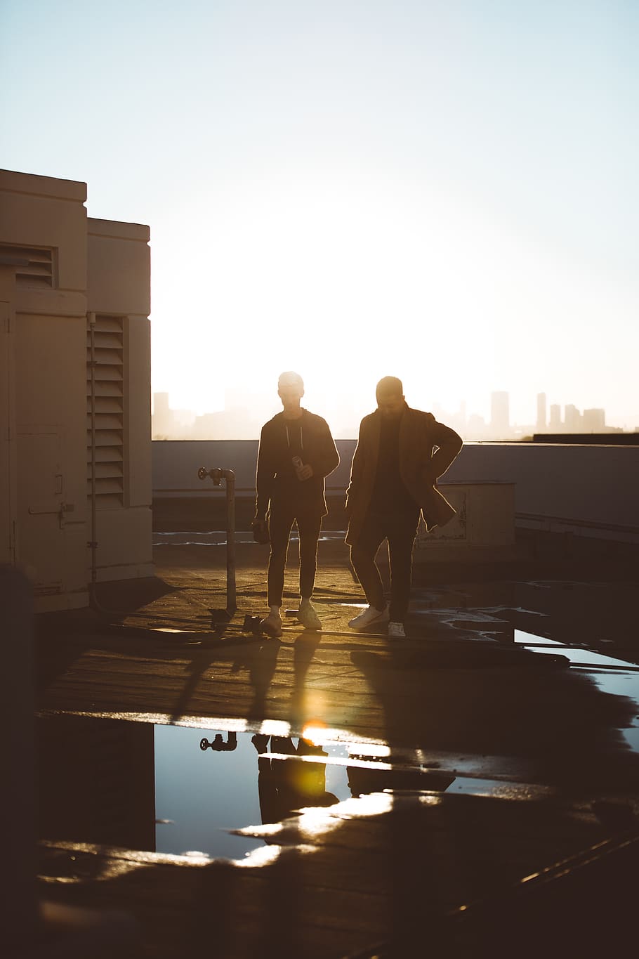 two men standing on rooftop, sky, architecture, real people, sunlight HD wallpaper