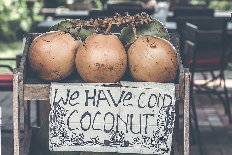 Tan Coconuts Placed Atop Brown Wooden Table, background, bunch HD wallpaper