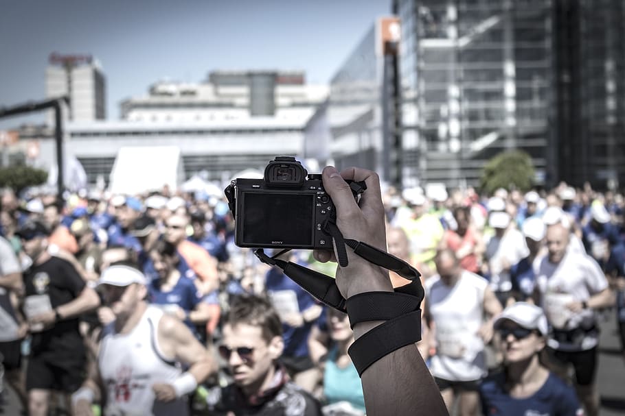 Person Hoding Camera Taking Photo of People, action, auto racing HD wallpaper