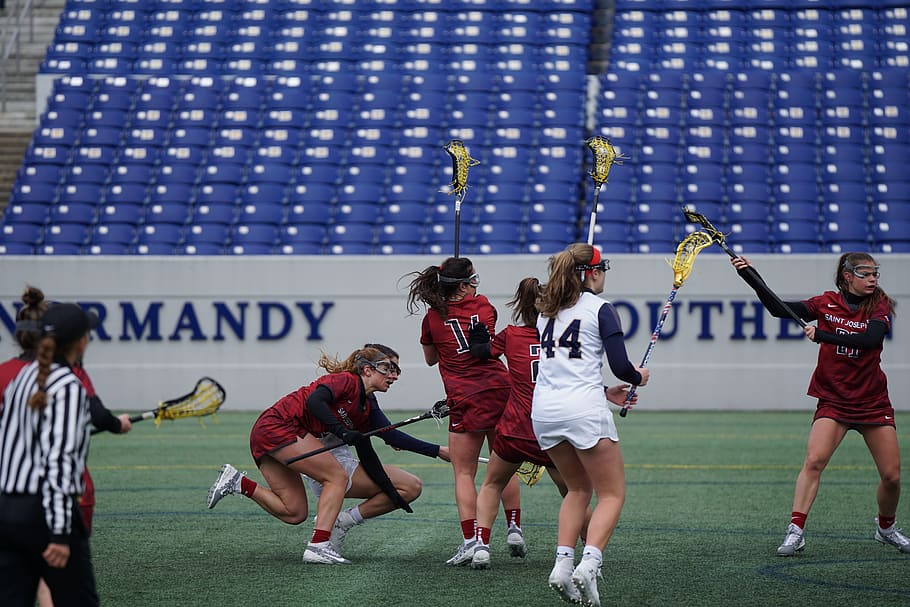 women playing lacrosse during daytime, group of people, real people HD wallpaper
