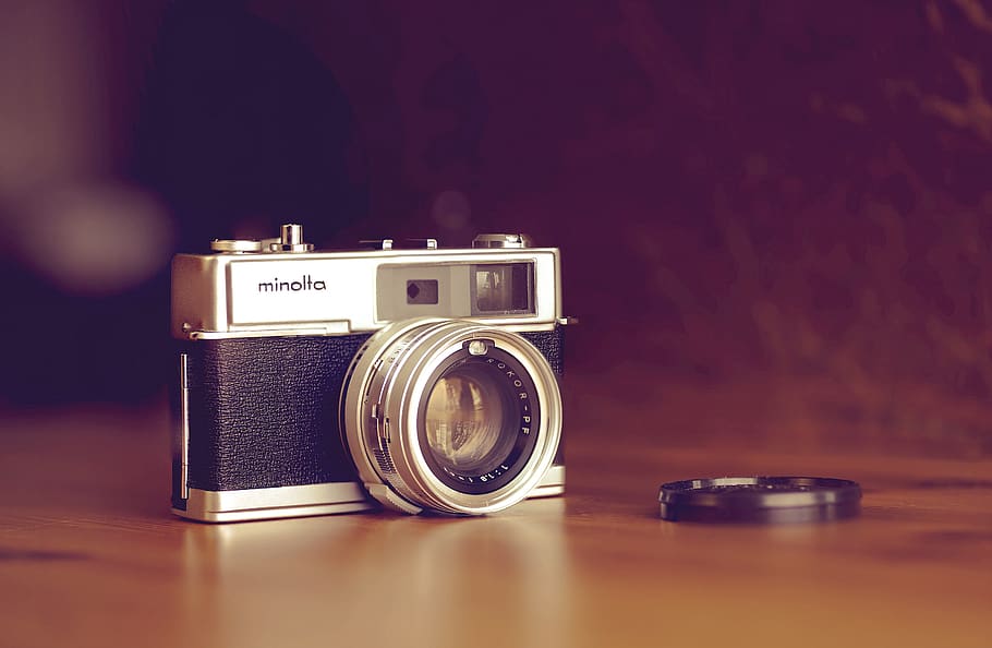 classic Minolta camera on table, electronics, digital camera