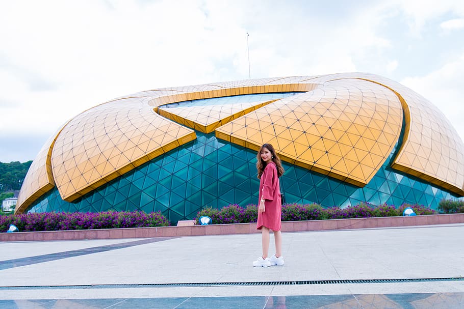 Woman Standing in Front of Yellow and Blue Glass Building, architecture HD wallpaper