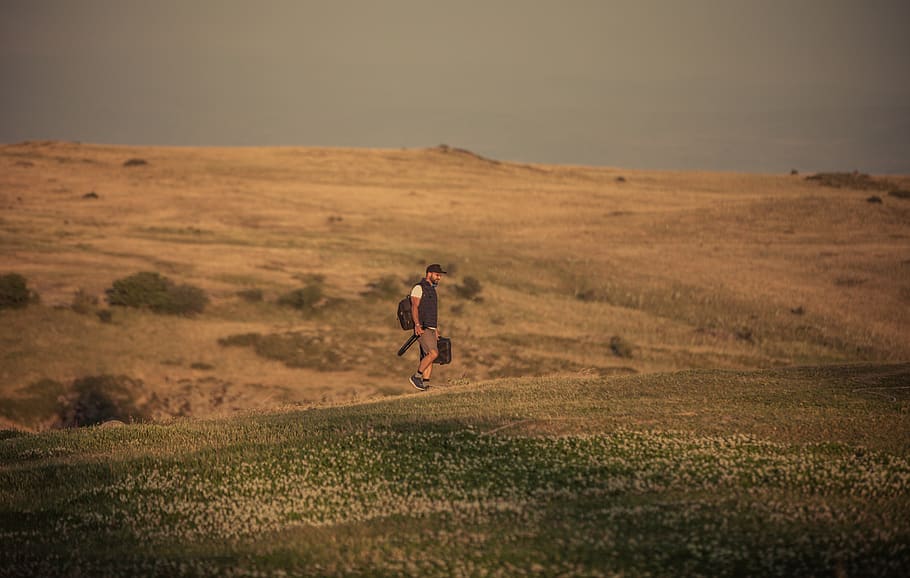 man walking along open field, armenia, saghmosavan, dirt road HD wallpaper