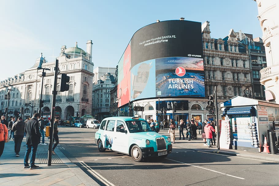 Classic Teal Car on Road Surrounded by People Near Building With Led Monitor Displaying Turkish Airlines during Daytimne, HD wallpaper