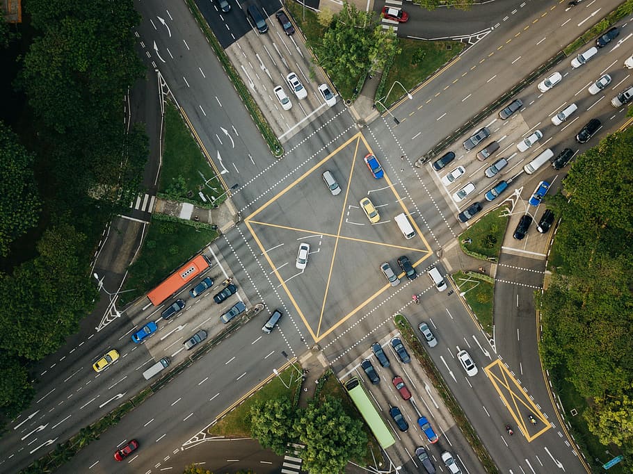 low-angle photography of vehicles passing road at daytime, intersection HD wallpaper