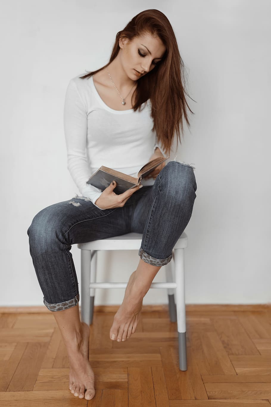 Beautiful young woman reading a book, adult, caucasian, female