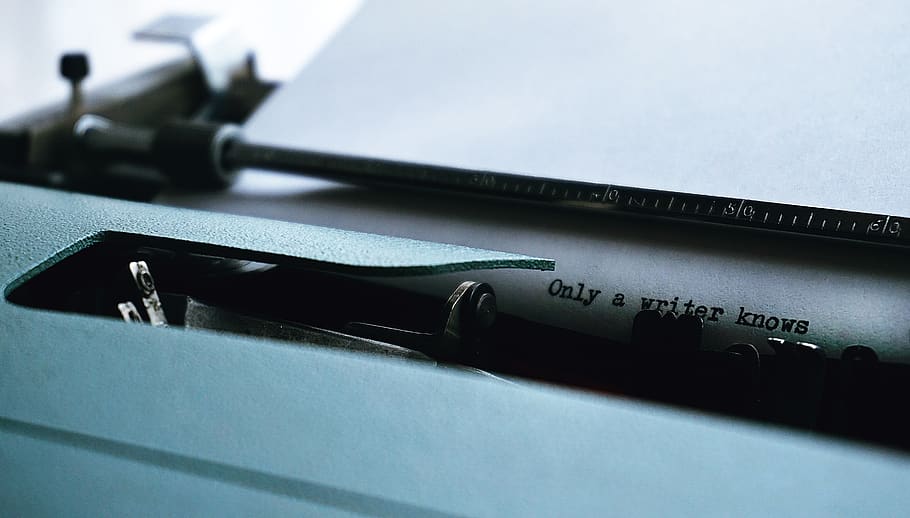 Close-up Photography of Typewriter With Only a Writer Knows Text on Printer Paper HD wallpaper