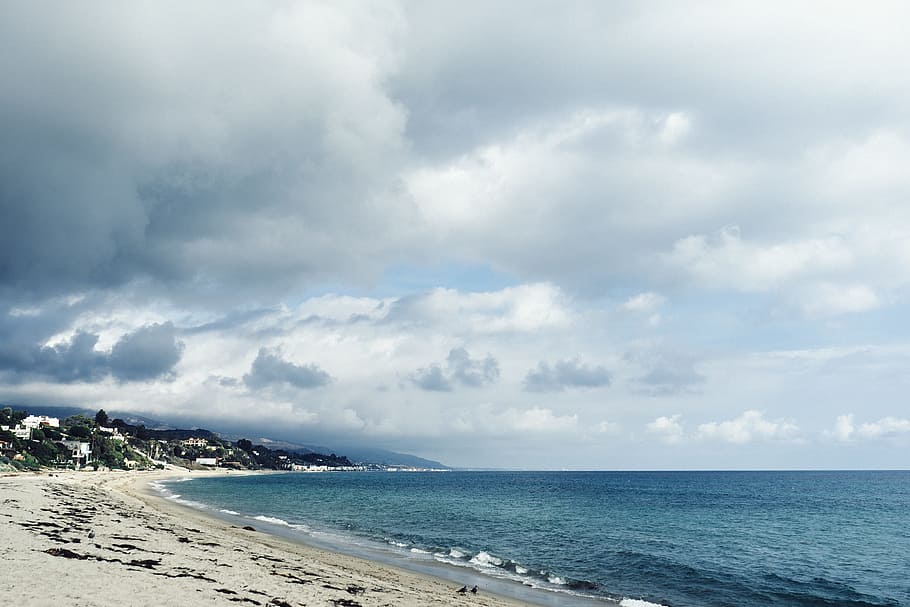 beach, sand, water, waves, ocean, sea, storm, clouds, sky, mountains HD wallpaper