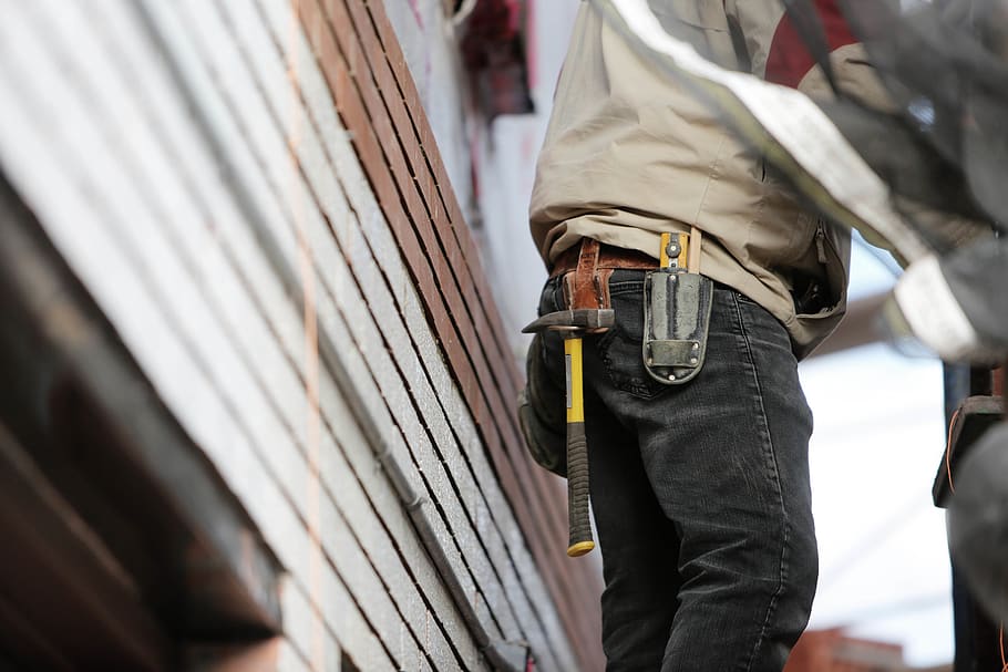 Man Wearing Black Denim Pants With Carrying Hammer on Holster HD wallpaper
