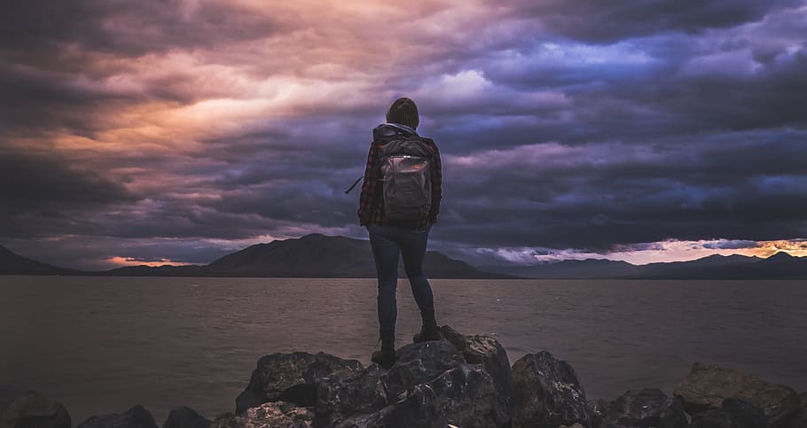 man standing on rock overlooking ocean, person, cloudy, water HD wallpaper