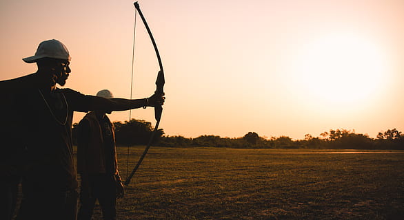 man holding bow during daytime, person, human, sport, sports HD wallpaper