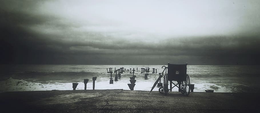 Grey Scale Photograph of Wheel Chair Near Water Sea, black-and-white