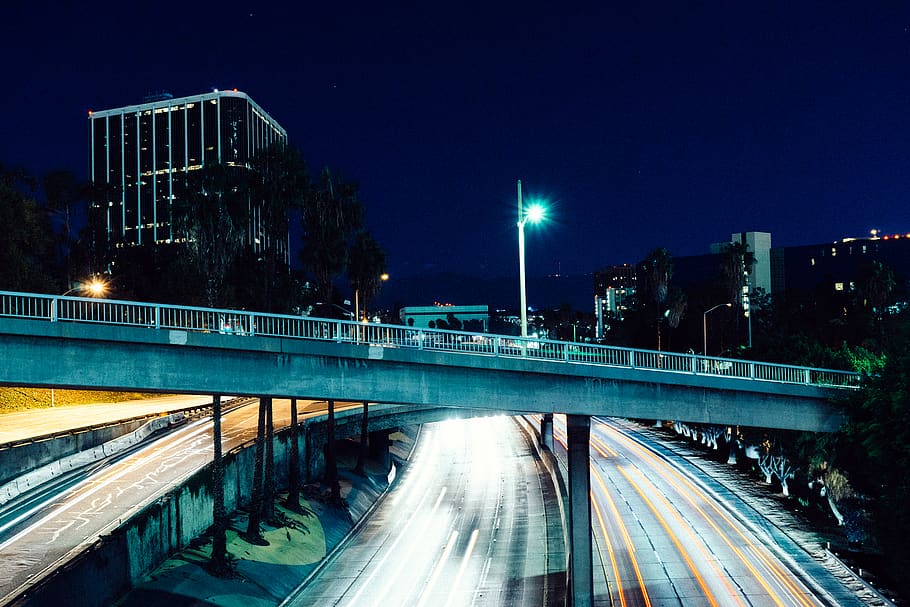 Gray Concrete Bridge Beside High Rise Building at Night, way HD wallpaper