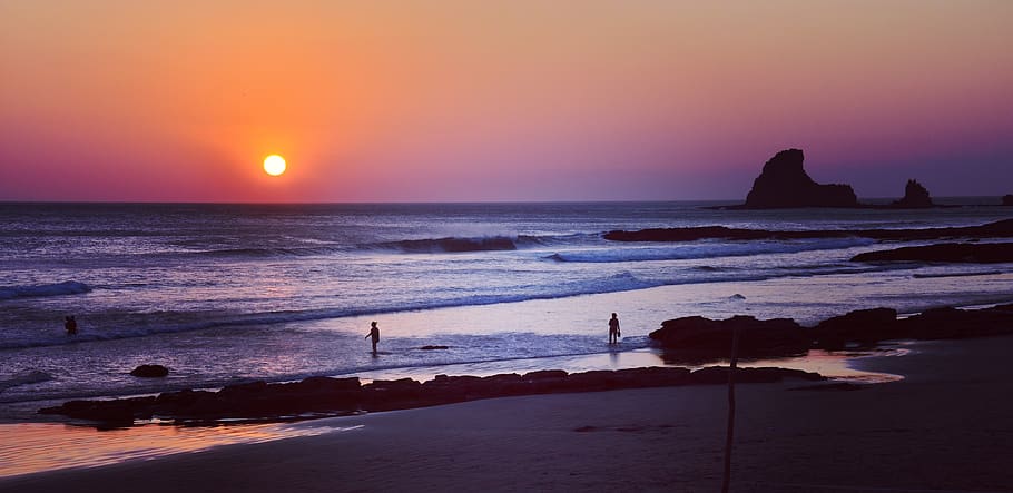 People on Body of Water during Sunset, beach, ocean, rocks, sea HD wallpaper