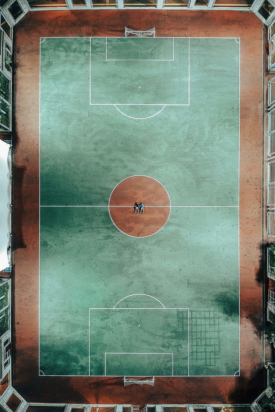 aerial photo of two people lying on green and brown sports court, HD wallpaper