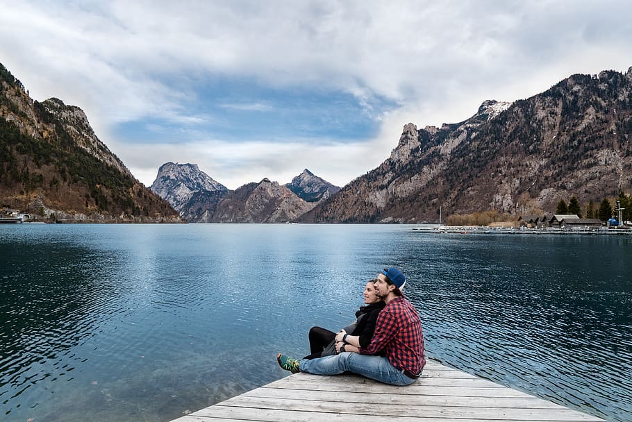 Man and Woman Sitting on Brown Wooden Dock, beautiful, clouds HD wallpaper