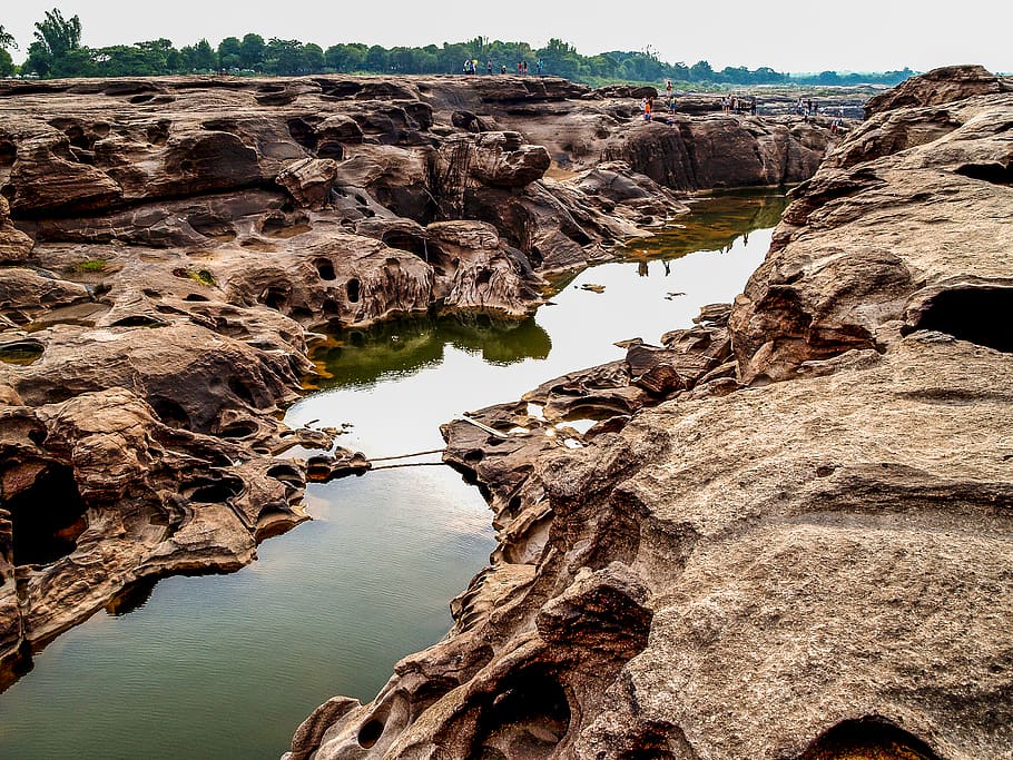 Body of Water in Between Rock Formation, background, beautiful HD wallpaper