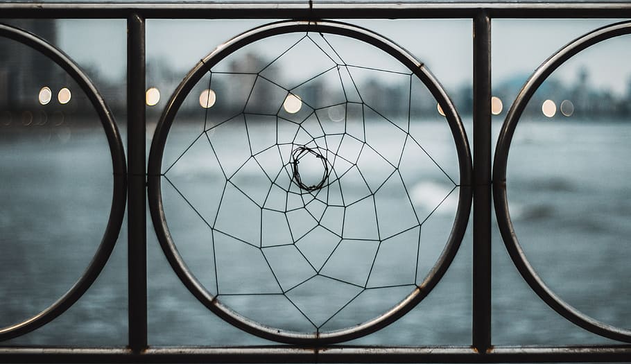 Closeup Photo of Black Wrought Iron Frame Near Body of Water HD wallpaper
