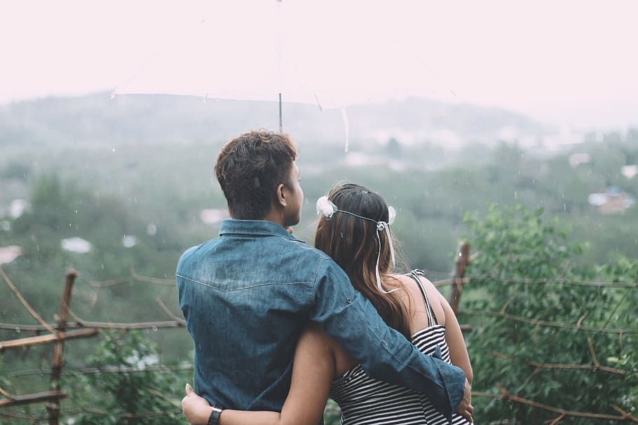 Man And Woman Cuddling Each Other , couple, people, raining, real people HD wallpaper