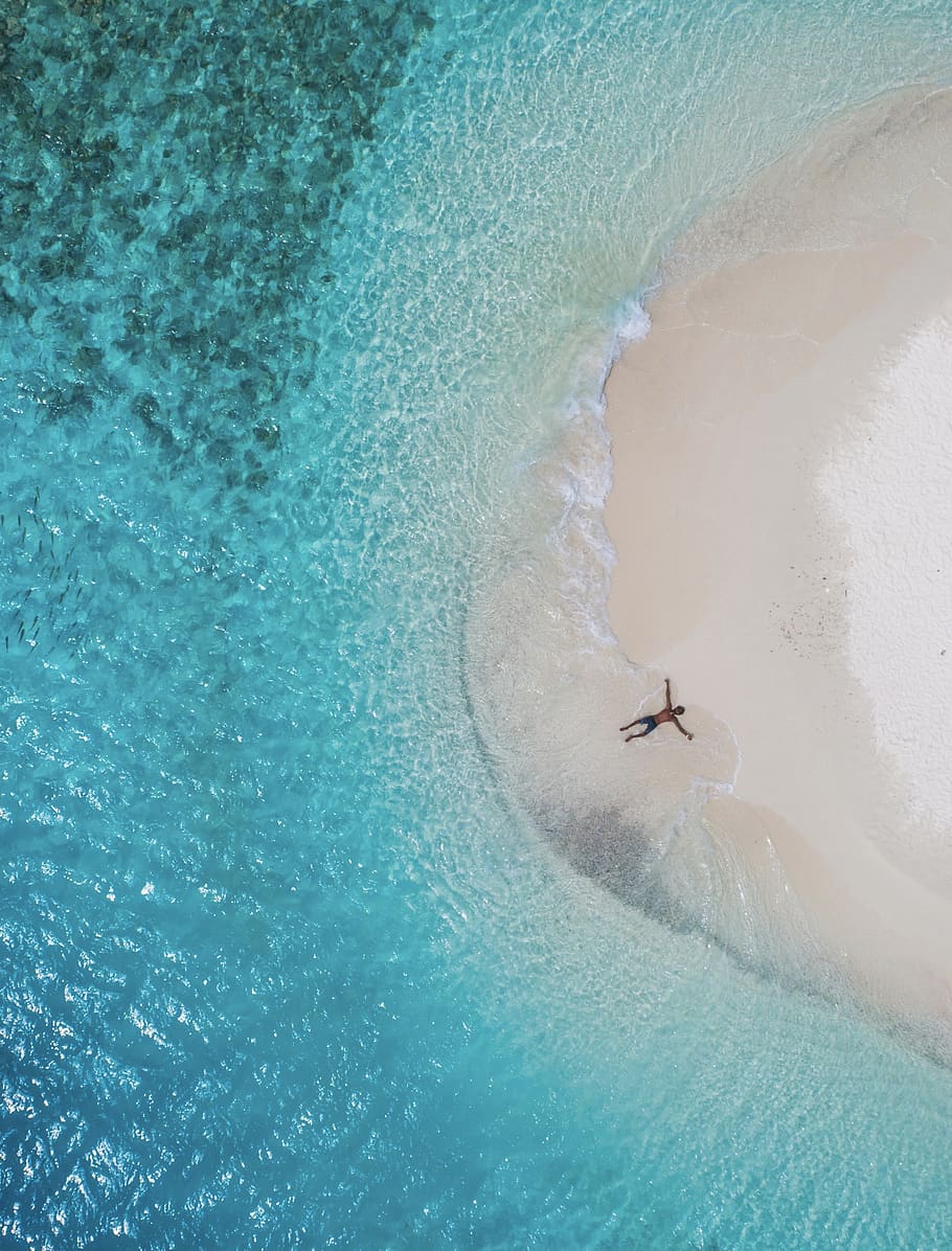 person lying on seashore, water, holiday, trip, vacations, beauty in nature HD wallpaper