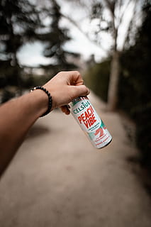 Celsius Peach Vibe bottle, person, human, tin, can, finger, spray can HD wallpaper