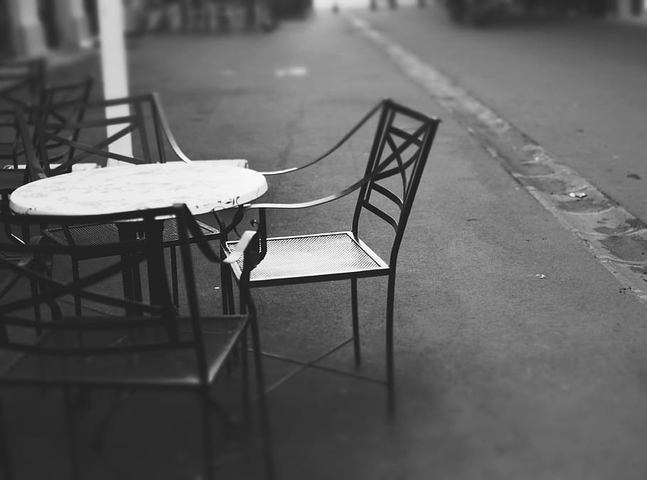 round table with four chairs placed on concrete surface, furniture