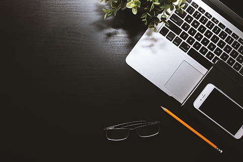 Black work table with laptop, smartphone and glasses, computer HD wallpaper
