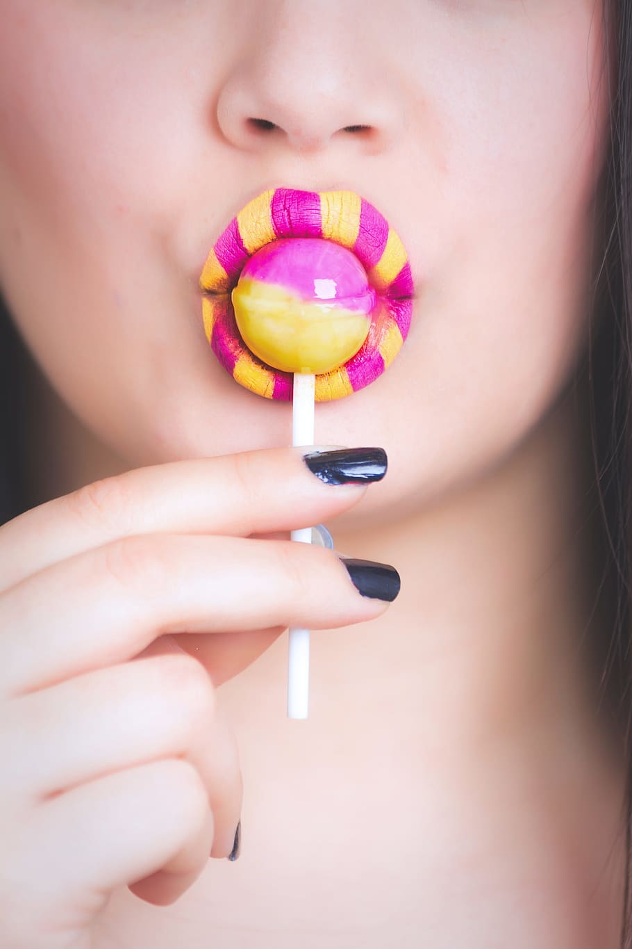 Woman Eating Pink and Yellow Lollipop, beauty, candy, close-up