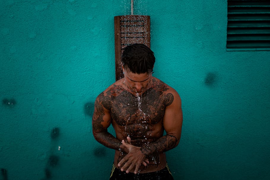 man holding his stomach, shower, male, wet, water, clean, african american