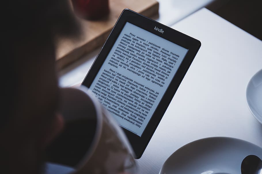 Person Using E-book Reader While Drinking Coffee, amazon, e-ink