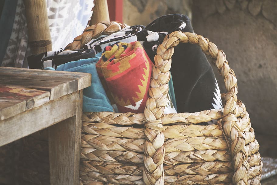 assorted rolled textiles on brown basket, container, no people HD wallpaper