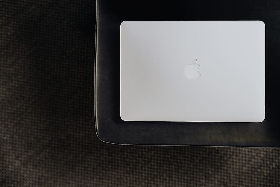 Stylish workspace with MacBook computer on home or studio, tech HD wallpaper