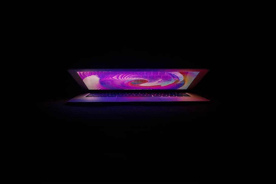 silver laptop computer, illuminated, black background, copy space HD wallpaper