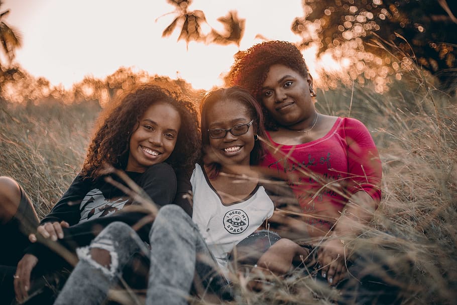 Three Women Sitting on Grass, adult, bestfriends, daylight, enjoyment