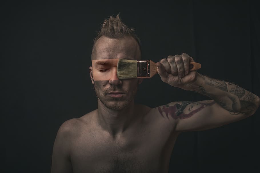 man holding paintbrush, shirtless, black background, one person HD wallpaper