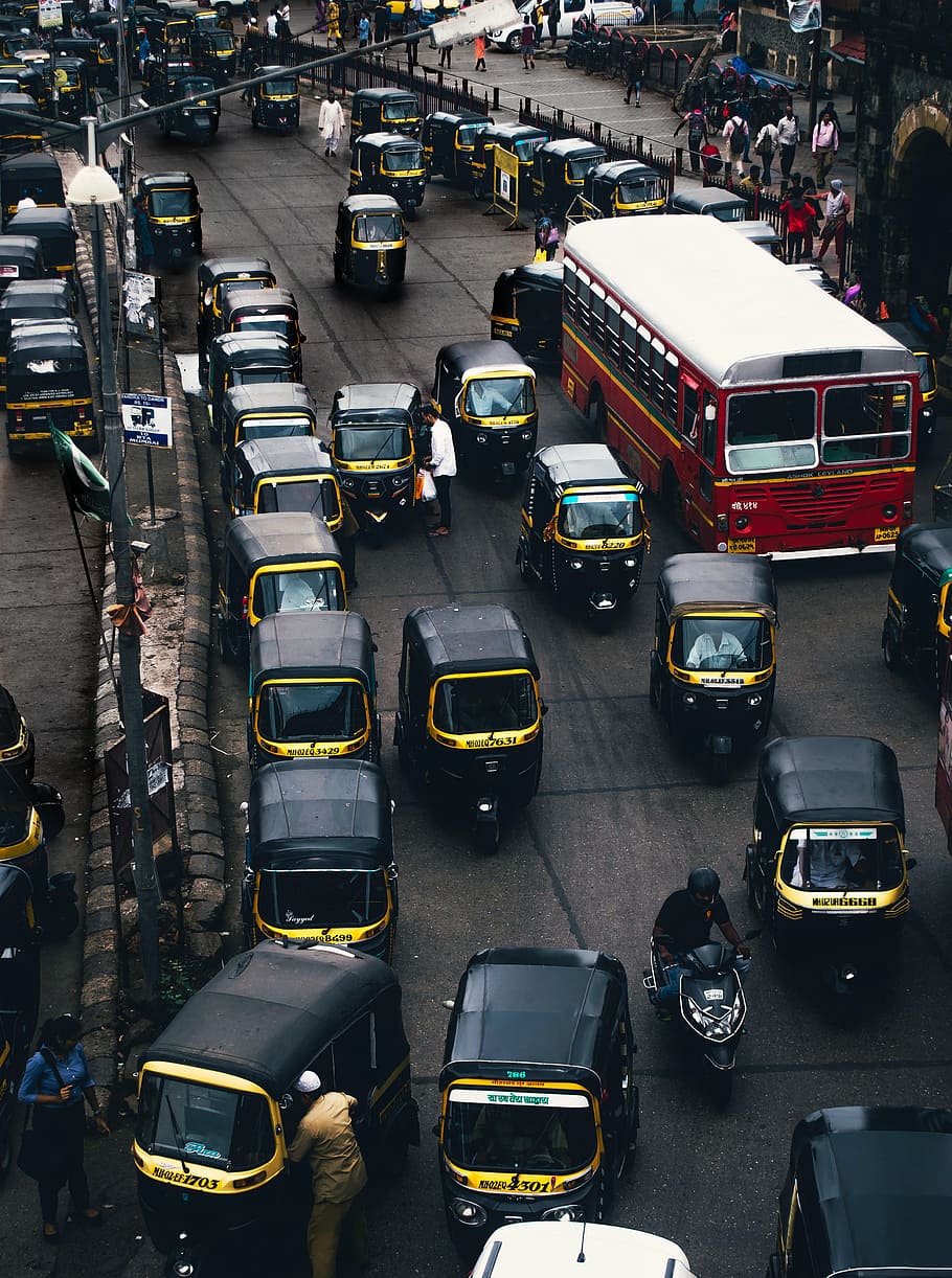 black-and-yellow auto rickshaw on road, city, street, car, traffic