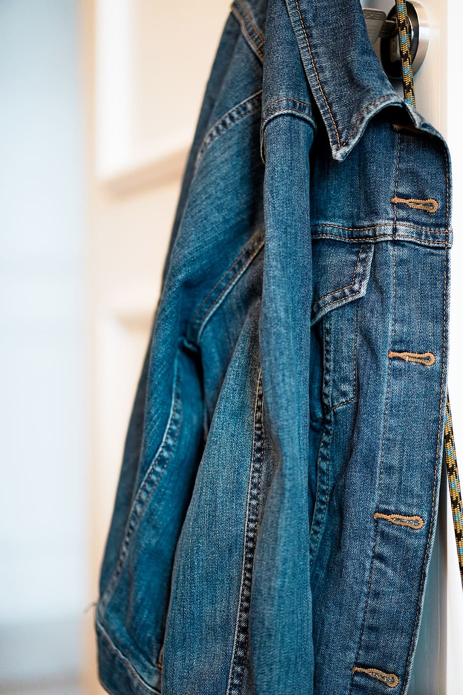 blue denim jacket hanging on wall, clothing, apparel, pants, coat HD wallpaper