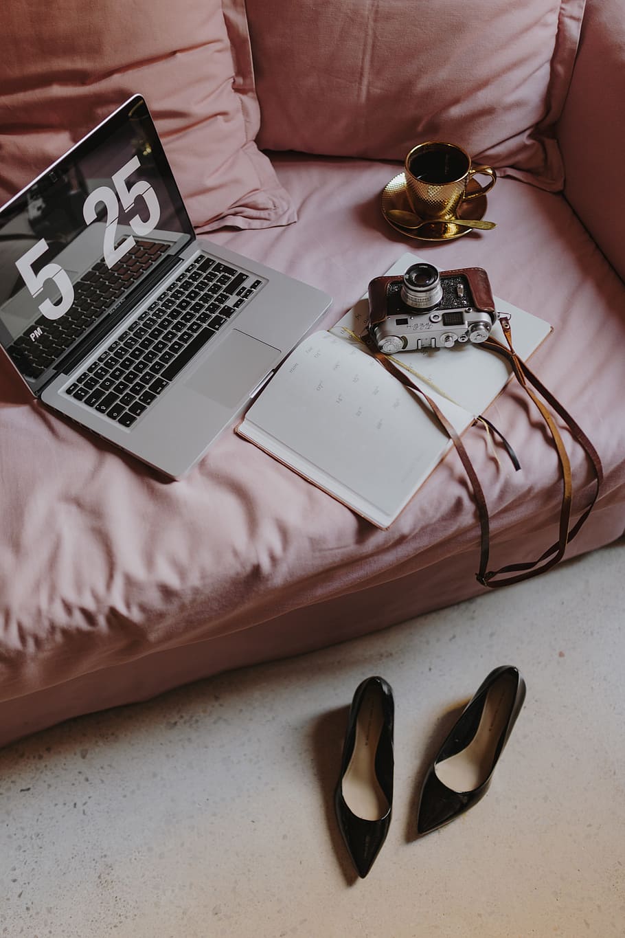 Workplace with a laptop on a pink couch, macbook, macbook pro HD wallpaper