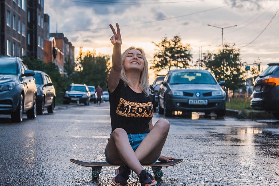 Woman Sitting on Skateboard While Gesturing Peace Sign Taken, HD wallpaper