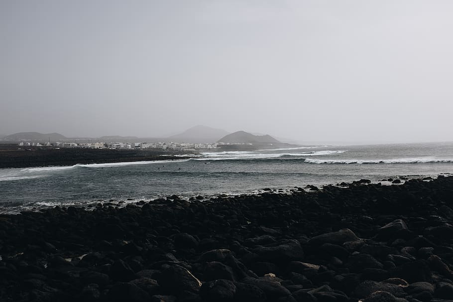 Seashore Beside Mountain, beach, clouds, cold, dawn, fog, horizon HD wallpaper
