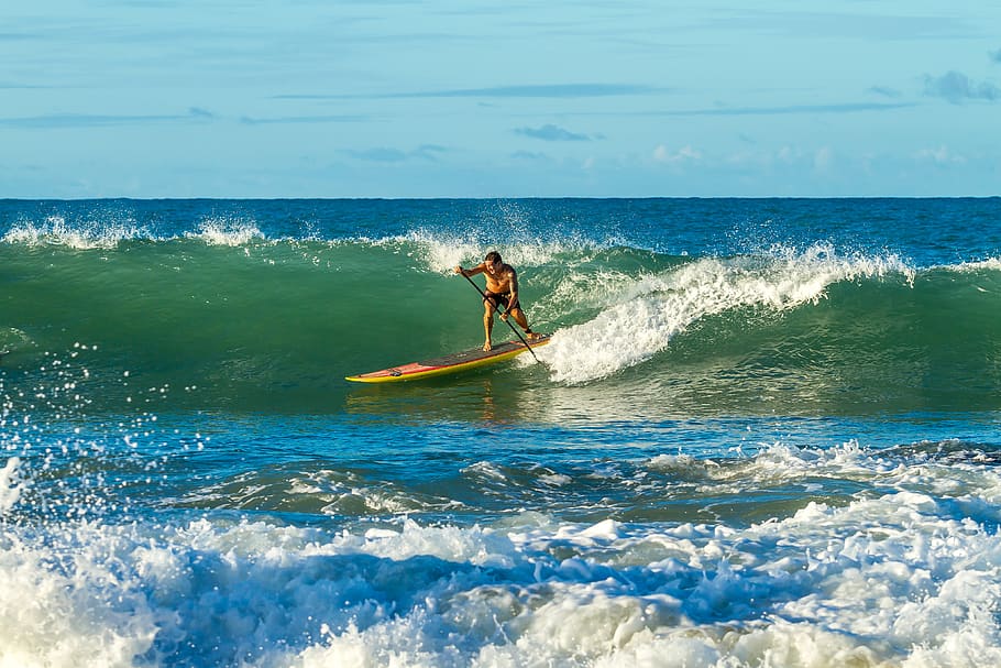 Man Paddling on Paddle Board With Ocean Waves, action, daytime HD wallpaper