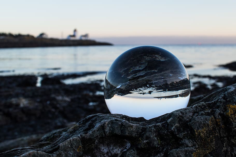 Clear Ball on Gray Rock, crystal, crystal ball, ocean, reflections HD wallpaper