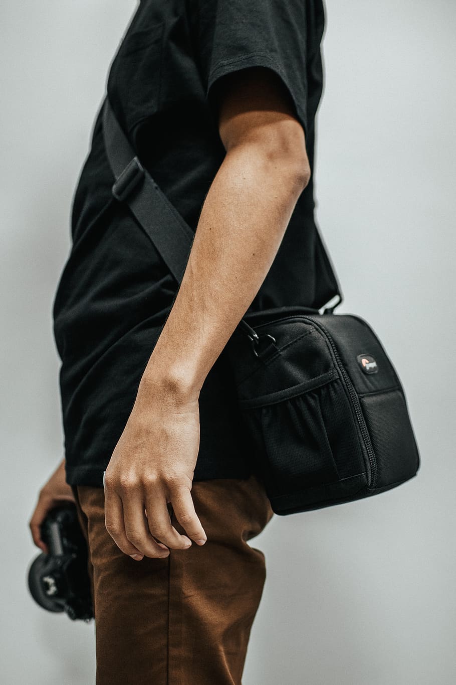 Man Holding Camera While Standing, gear, kit, person, one person HD wallpaper