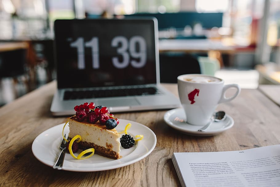Working in a restaurant: Macbook, Cheese Cake and Cup of Coffee HD wallpaper