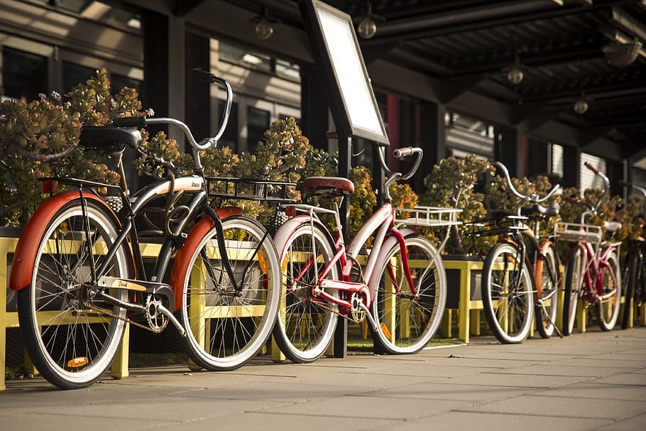 Four Beach Cruiser Bikes Parked Beside Railings, bicycles, pavement HD wallpaper